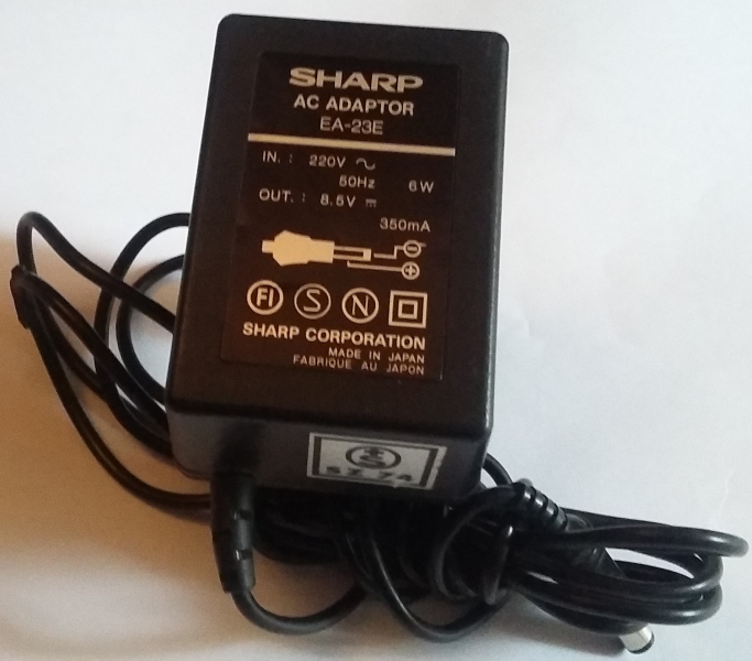 SHARP AC ADAPTOR EA-23E IN.:220V  50Hz 6W OUT.:8.5V 350mA SHARP CORPORATION