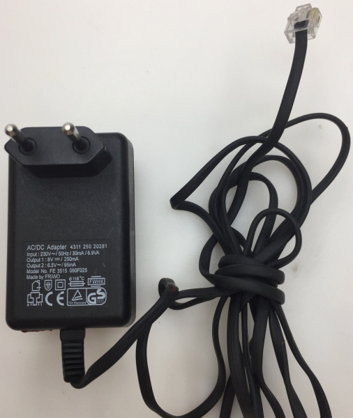 FE3515 080F025 INPUT 230V-50Hz 30mA 6.9VA OUTPUT1 8V-250mA OUTPUT2 6.5V-95mA AC/DC ADAPTER